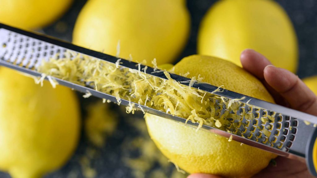 Hand zesting lemon